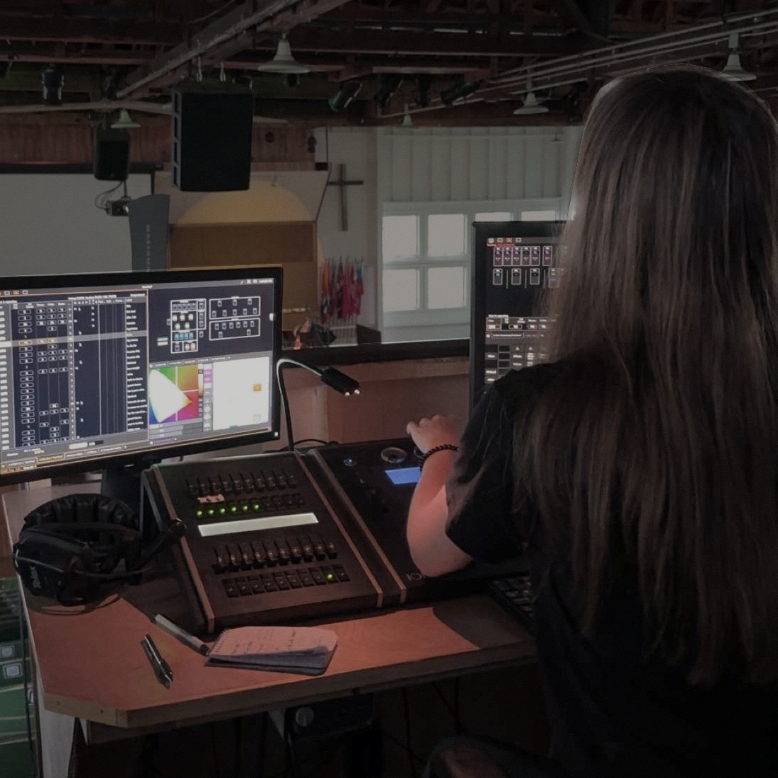 Raven Flaig working on sound cues during a live production